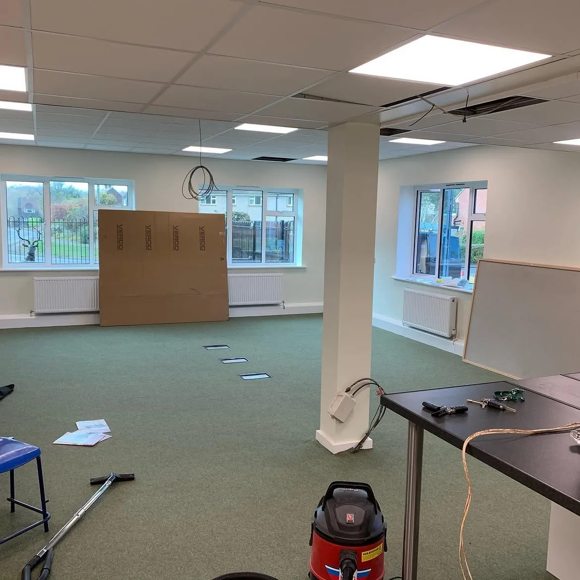 Office floor boxes installed with power and data outlets set into the finished floor