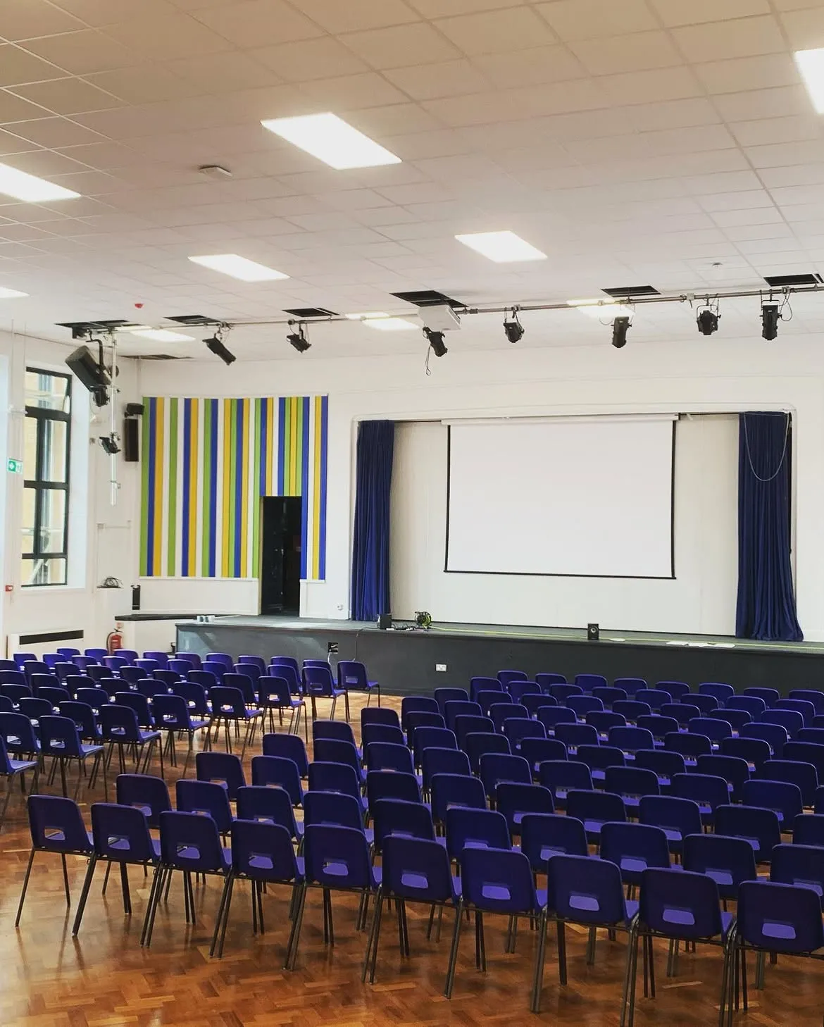 Completed school hall in Surrey with new LED panel lighting and a stage lighting bar