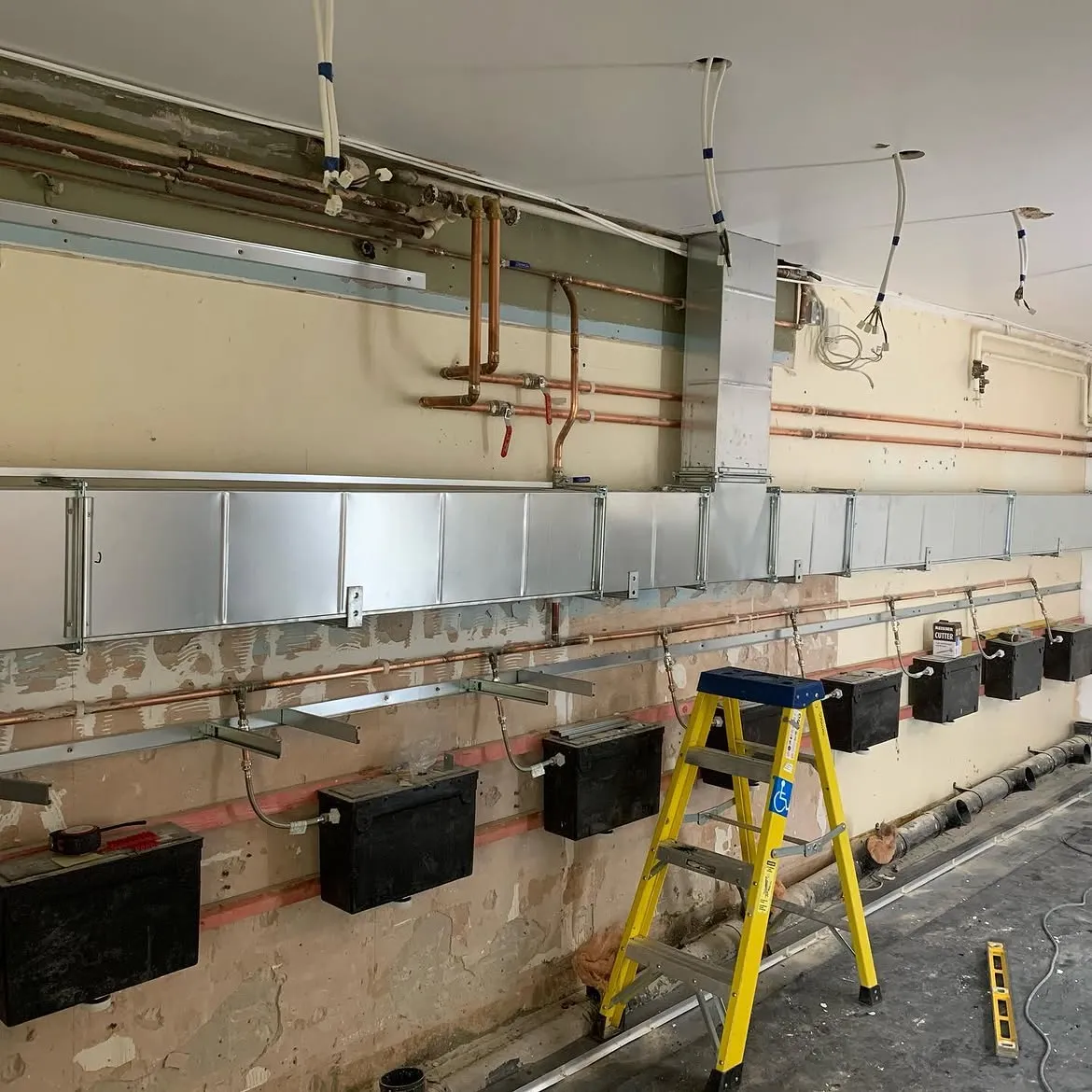 First fix containment and pipework for a new ventilation system in a school in Surrey